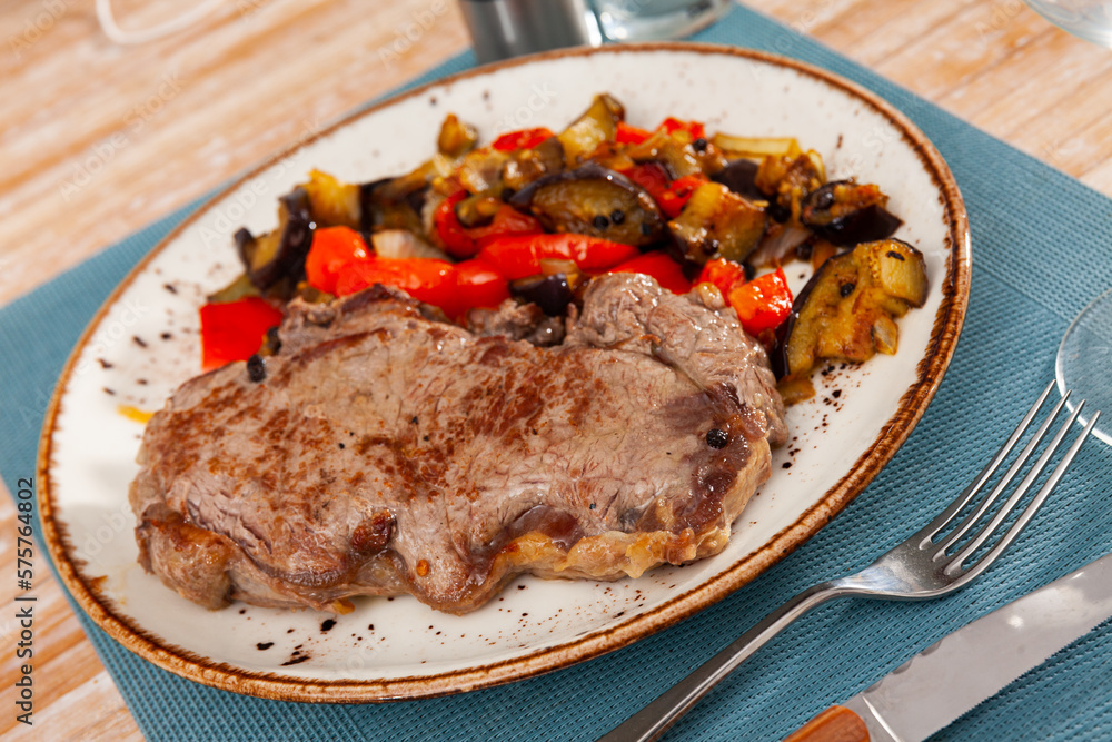 Fried veal cutlet with roasted vegetables, healthy dinner