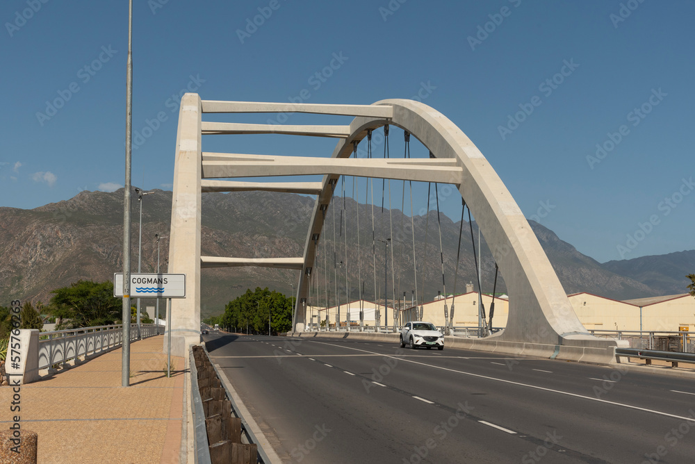 Fototapeta premium Ashton, Western Cape, South Africa. 2023. Arched bridge supporting a four laned carriagway over the Cogmanskloof river in Ashton, South Africa.