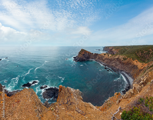 Summer Atlantic ocean rocky coastline (Algarve, Portugal).