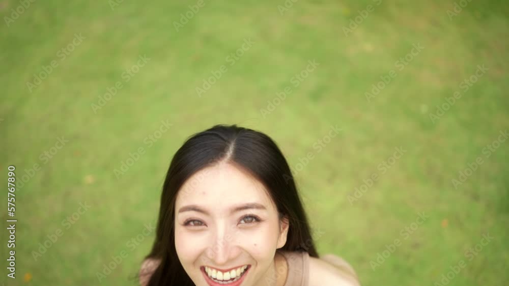 Candid Happy feeling of Beautiful Young Woman smiling outdoor in sunlight. Pretty face of female and beautiful smile. Candid Happy feeling of Beautiful Young Woman smiling outdoor in sunlight. Pretty face of female and beautiful smile.
