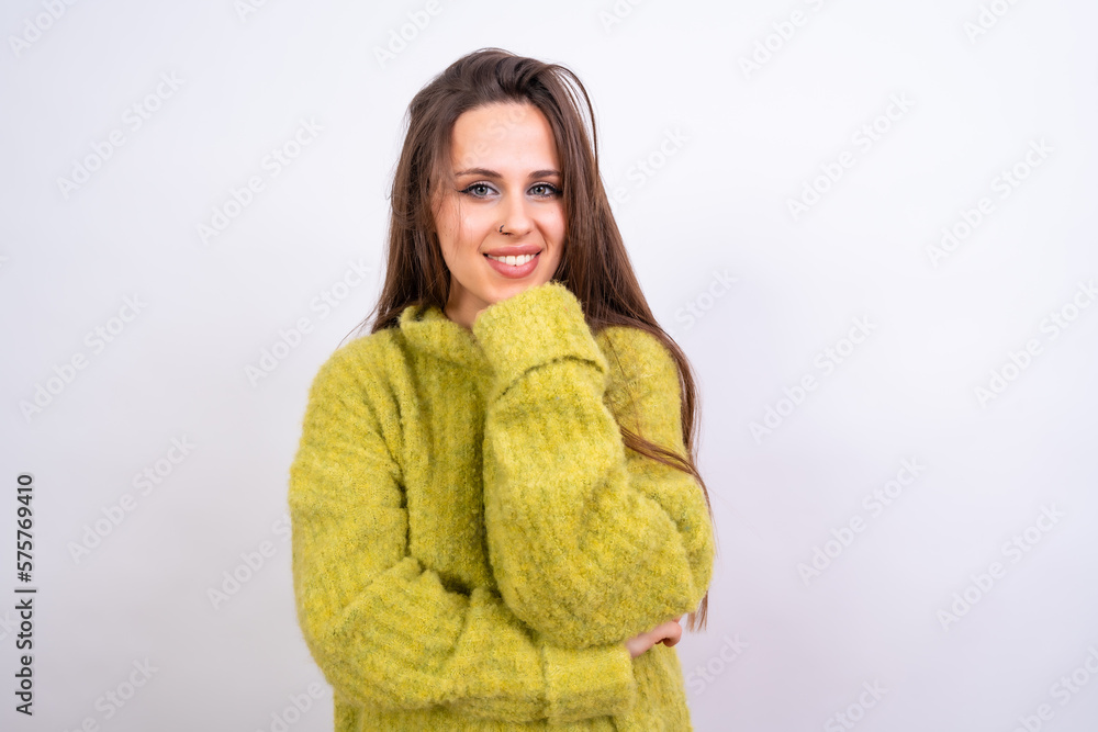 Close up portrait of young, cheerful isolated on white studio background in green woolen pullover Close up portrait of young, cheerful isolated on white studio background in green woolen pullover
