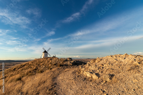 Windmills on hill at sunset in Consuegra, Mancha, Spain
