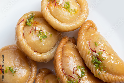 Chandrakala And Gujiya Mithai Also Called Suryakala, Gujia, Pirukiya, Pirukia, Pedakiya, Karanji, Basundi, Gughra Is Made Of Suji Ghee, Mawa Khoya Chasni Mava Khoa On Deepawali, Teez, Holi, Teej photo