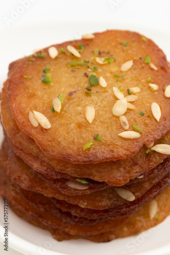 Juicy Sugary Pancakes Sweets Also Called Malpua, Pooa Or Pua Are Traditional Indian Dessert Mithai Drenched, Dunked, Soaked Or Dip In Sugar Syrup Cheeni Ki Chasni. Enjoyed On Holi, Navratri and Diwali photo