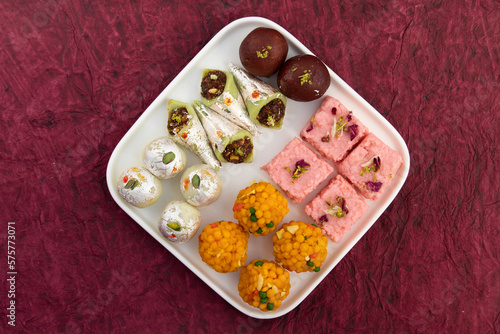 Variety Of Assorted Desi Ghee Indian Mithai viz. Laddu, Kesar Barfi, Kalakand, Kaju Barfi, Gulab Jamun. Traditional Sweet Food for Diwali, Holi, Rakshabandahan, Navaratri, Dussehra, Janmashtami Puja photo