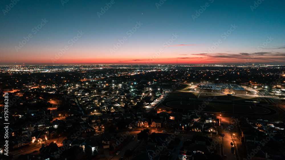 sunset over the city: Blue hour where the sun sets and the night begins, the streets and the city are illuminated