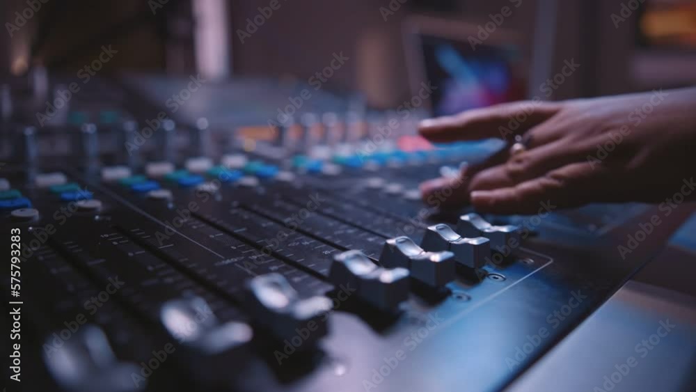 sound engineer fingers on audio mixing console fader in recording, broadcasting studio sound engineer fingers on audio mixing console fader in recording, broadcasting studio