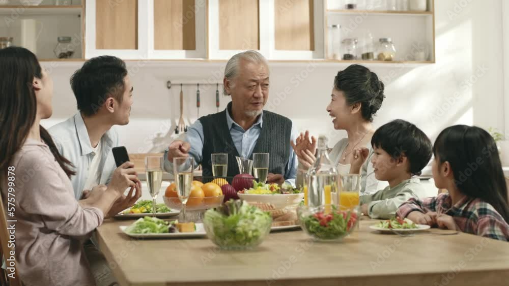 three generation happy asian family eating meal and enjoying reunion at home three generation happy asian family eating meal and enjoying reunion at home