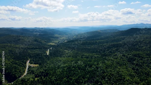 Cinematic aerial shot of an endless mountain and forest landscape in southern Slovenia photo