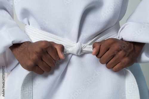 Taekwondo teenager latins white belt on white kimono. latins