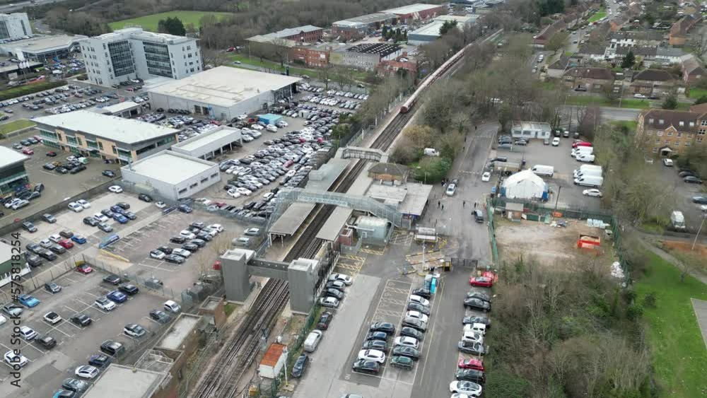 Train leaving Debden Central line station Essex UK drone aerial view Train leaving Debden Central line station Essex UK drone aerial view