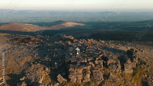 Aerial Drone footage of the majestic Galtymore Mountain Range in Ireland. Soaring above rugged terrain, winding trails, and stunning greenery for awe-inspiring views. Perfect for adventure travelers. photo