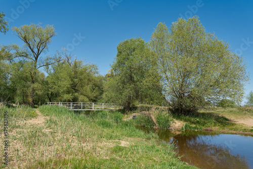 der kleine Fluss Ehle an der hohen Brücke nahe der Gemeinde Biederitz am Elberadweg photo