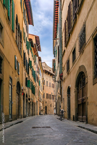 Gothic buildings on a narrow street in Centro Storico of Florence, Italy