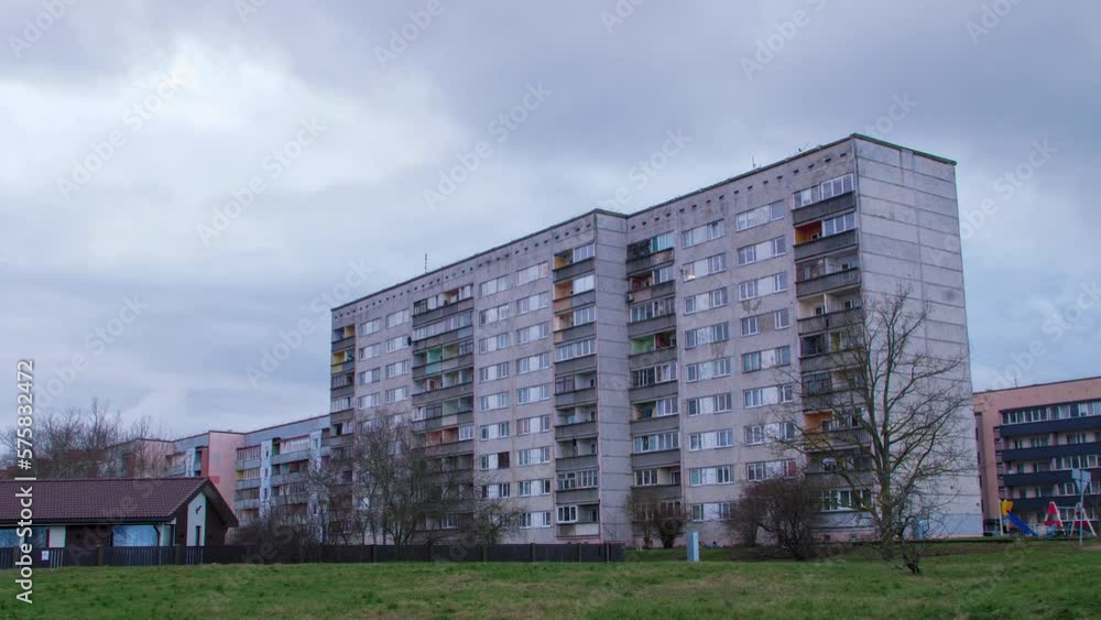 Beautiful timelapse view of fast moving rain clouds over old Soviet time apartment buildings in Liepaja city, overcast day, wide angle shot Beautiful timelapse view of fast moving rain clouds over old Soviet time apartment buildings in Liepaja city, overcast day, wide angle shot