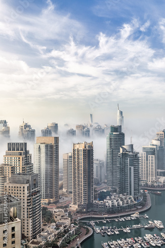 Photography Aerial view of Dubai Marina on a foggy morning