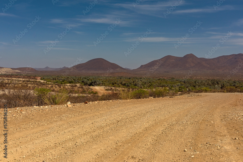 The dusty gravel road along the Kunene River in northern Namibia