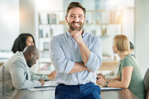 Leader, entrepreneur and startup founder smile for company strategy in a meeting with a positive mindset in a boardroom. Portrait, happy and business man confident, proud and excited for conference photo