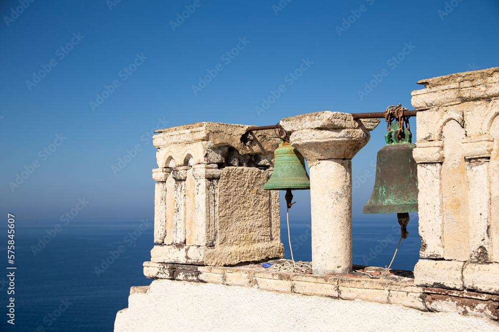 Fototapeta premium Domes, steeples, bells and white buildings of Santorini, Greece 
