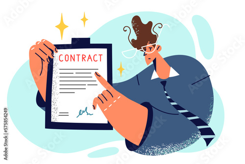 Businessman pointing finger at signed contract to force partners to fulfill their obligations