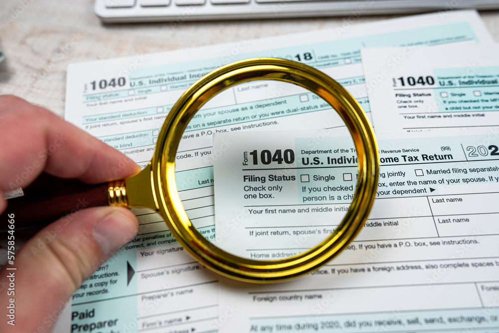 blank of individual tax form with magnifying glasses blank of individual tax form with magnifying glasses