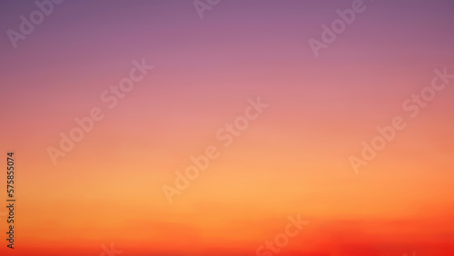 Blurred background of colorful Romantic sky with beautiful sunlight on twilight sky after sundown, natural backdrop design and free space 