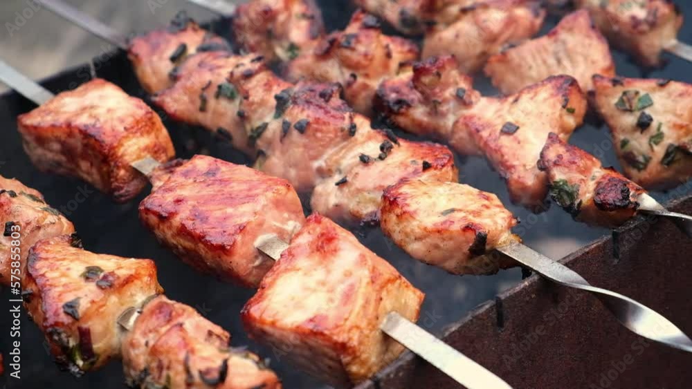 Cooking shish kebab on the grill. Cooking marinated meat on coals. Cooking meat on coals. Cooking shish kebab on the grill. Cooking marinated meat on coals. Cooking meat on coals.