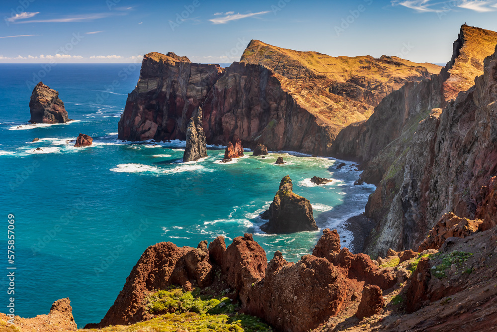 View from Ponta do Rosto on the Ponta de Sao Lourenco peninsular, a popular lookout offering views of the jagged coastline and offshore rock formations at the eastern tip of Madeira. - obrazy, fototapety, plakaty 