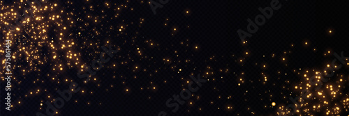 Golden glitter.Light effect.Glittering particles background. Gold dust on a transparent background.