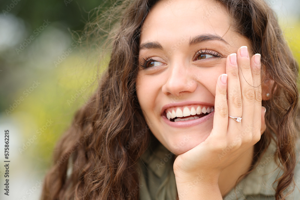 Happy fiencee smiling showing ring at camera Happy fiencee smiling showing ring at camera