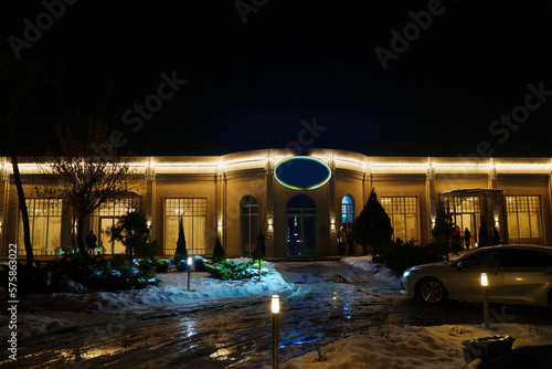 restaurant with lighting on a winter street.  © andrey