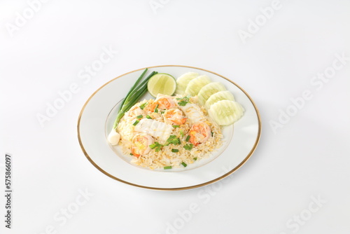fried rice with shrimp and squids on a white plate, yummy Thai food.