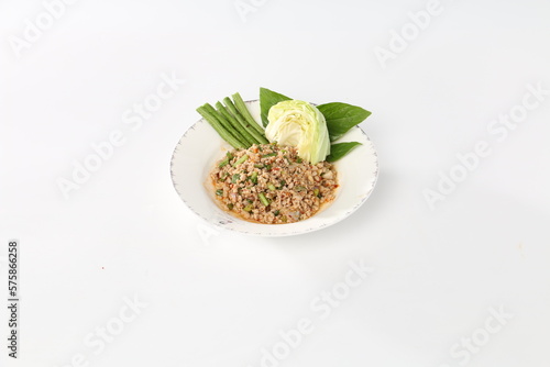 spicy minced pork salad is eaten with fresh cabbage, Isaan foods, and local north-eastern Thailand foods.