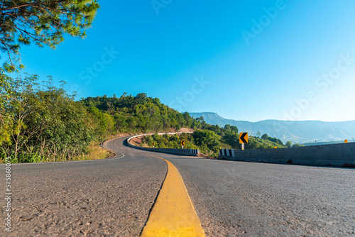 close-up yellow line on the curve road in Thailand