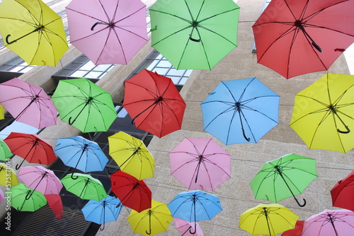 Colored umbrellas on the background of the building
