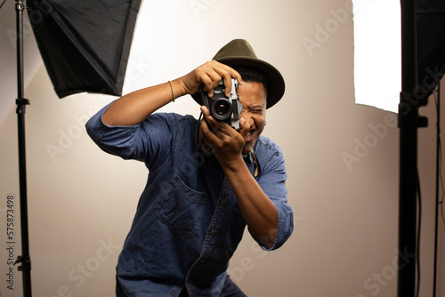 Photographer clicking photo in studio photo