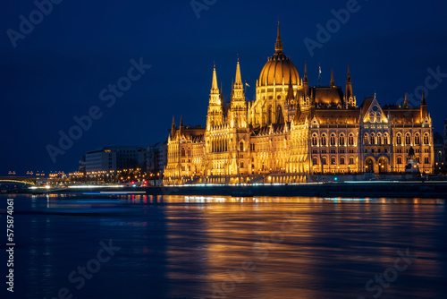 Hungarian Parliament building and Margit Hid, Margaret Bridge. Beautiful night-time view with reflection in Danube river, Budapest, Hungary. Long exposure. © salarko