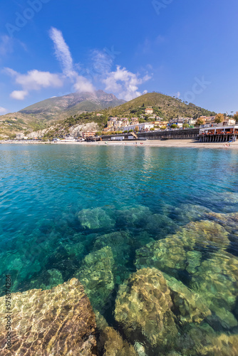 Italy, Liguria, Levanto, Seashore ofCinqueTerrewithSpiaggiaLevantobeach and hills in background photo