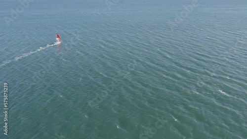 Drone Aerial view of Wind Surfer at Ria Formosa Wetlands Natural Park in Algarve, tourism destination region, Portugal.