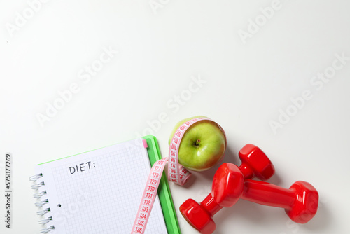 Diet and weight loss, healthy lifestyle, composition with measuring tape, space for text
