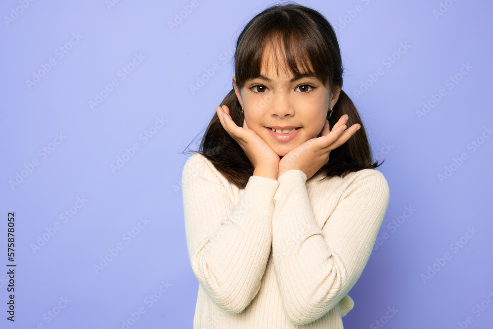 Portrait image with smiling little brown-haired girl. Concept happy and beauty kid with good healthy teeth for dental on purple background, eight year child looking at camera and posing Portrait image with smiling little brown-haired girl. Concept happy and beauty kid with good healthy teeth for dental on purple background, eight year child looking at camera and posing