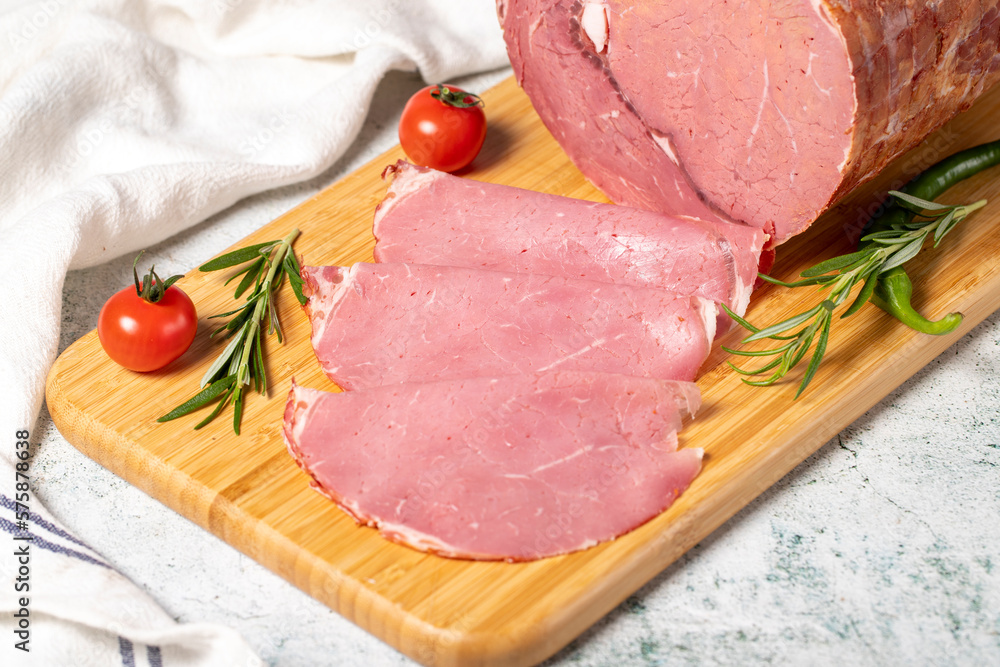 Sliced Smoked Beef Entrecote. Veal salami on wooden presentation board. Deli products. Meat products Sliced Smoked Beef Entrecote. Veal salami on wooden presentation board. Deli products. Meat products