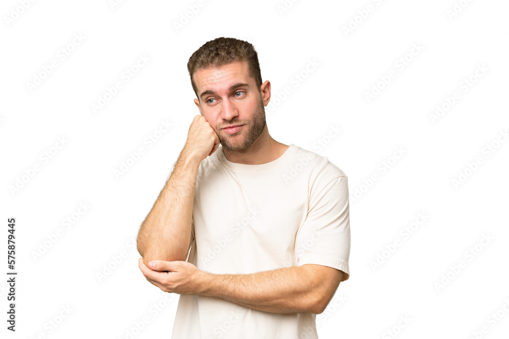 Young handsome caucasian man isolated on green chroma background with tired and bored expression Young handsome caucasian man isolated on green chroma background with tired and bored expression