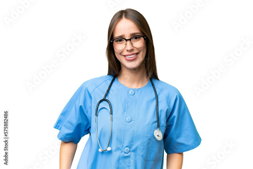 Young nurse caucasian woman over isolated background laughing