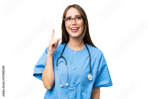 Young nurse caucasian woman over isolated background pointing up and surprised