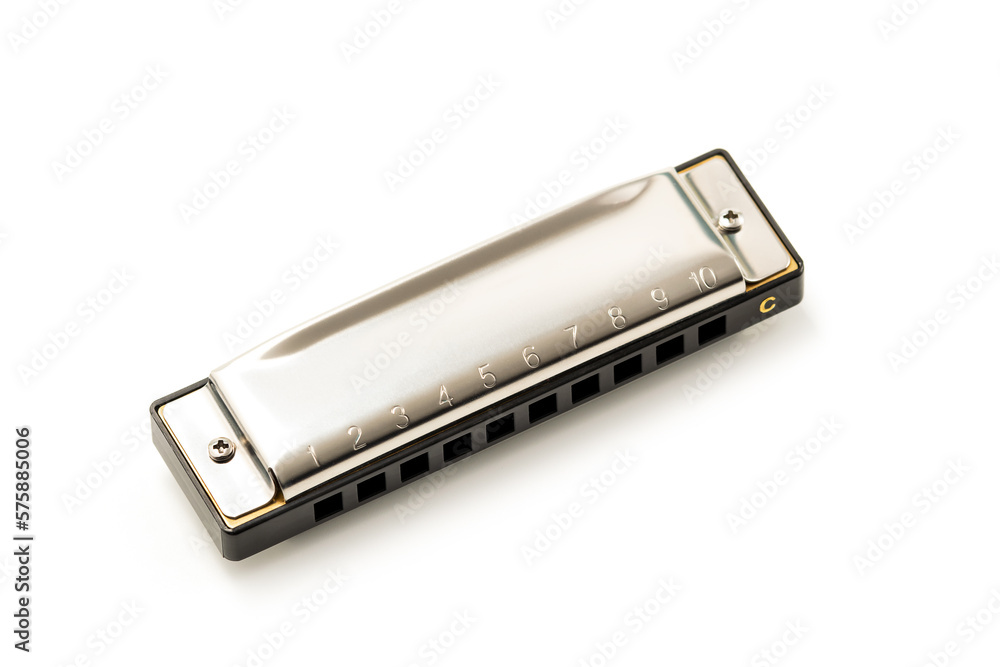 Harmonica, also French harp, blues harp, and mouth organ, isolated on white background with clipping path included. Free reed wind instrument used worldwide in blues, American folk music, jazz Harmonica, also French harp, blues harp, and mouth organ, isolated on white background with clipping path included. Free reed wind instrument used worldwide in blues, American folk music, jazz