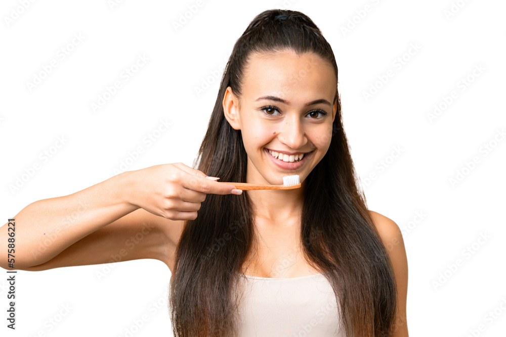 Young Arabian woman over isolated chroma key background with a toothbrush and happy expression Young Arabian woman over isolated chroma key background with a toothbrush and happy expression