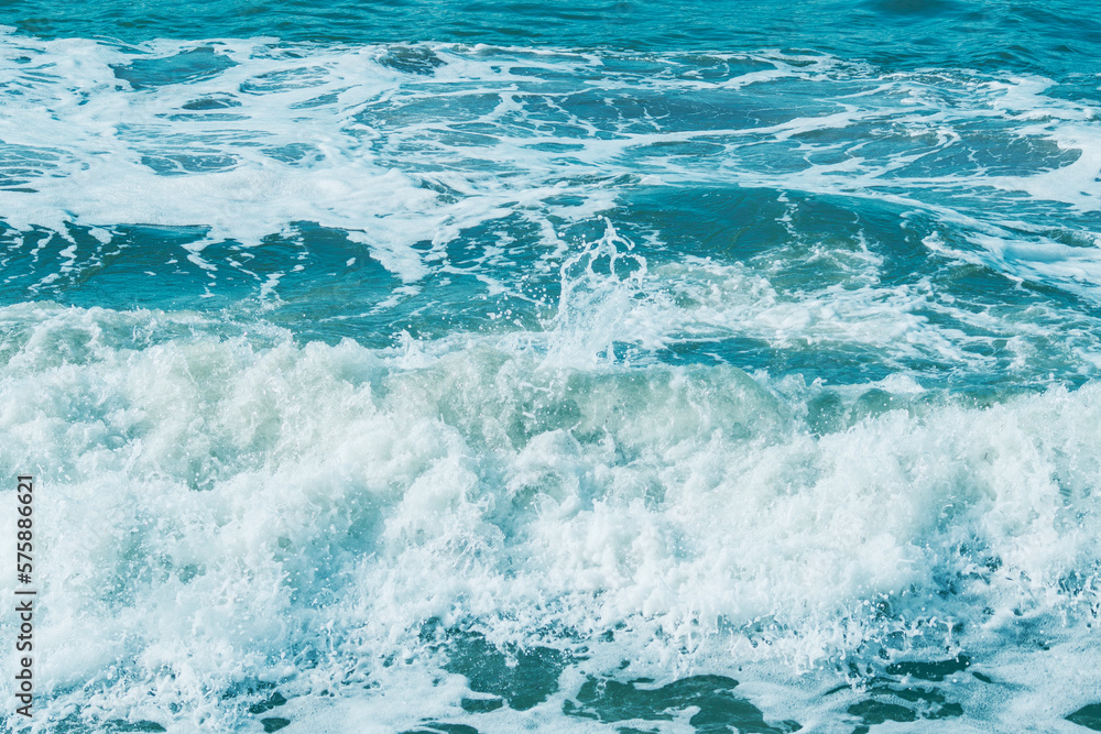 Background with sea waves. White foam on the surface of the water. Background with sea waves. White foam on the surface of the water.