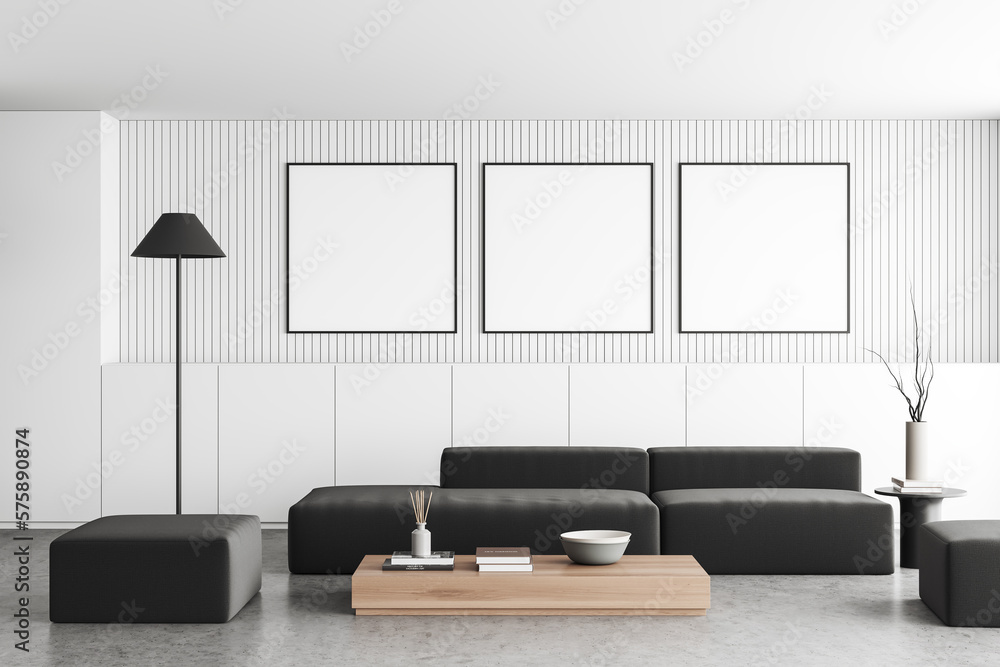 Light chill room interior with couch and coffee table, mockup posters