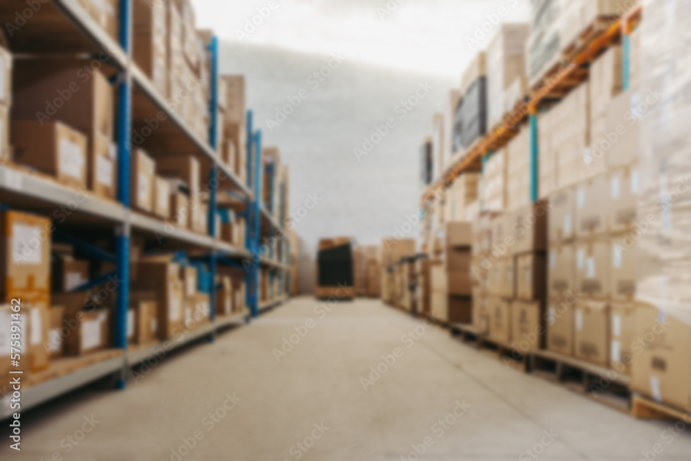 Blurred view of warehouse shelves filled with package boxes Blurred view of warehouse shelves filled with package boxes